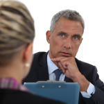 Businessman interviewing a young woman