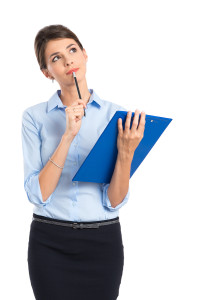 Thoughtful Young Businesswoman Holding Clipboard On White Backgr