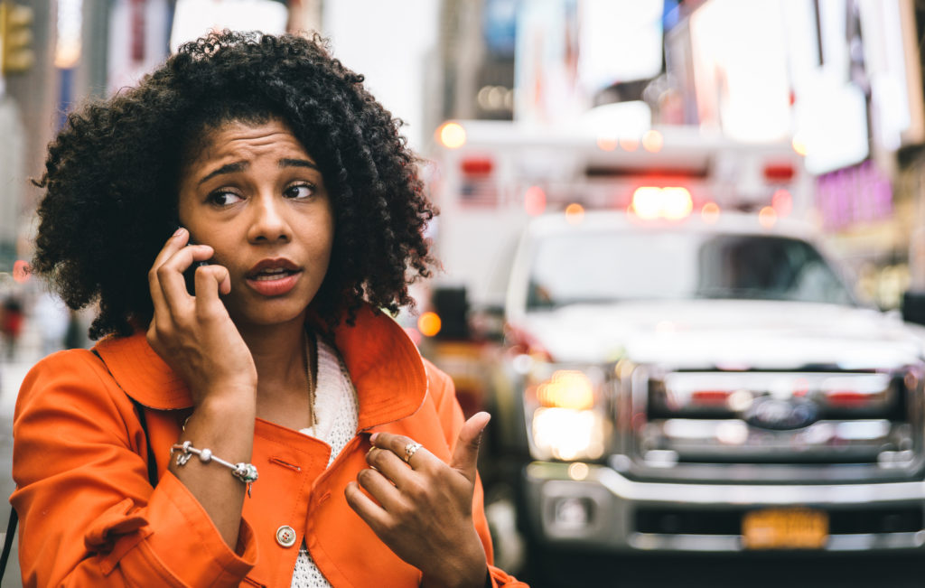 Afro American Woman Calling 911 In New York City. Concept About