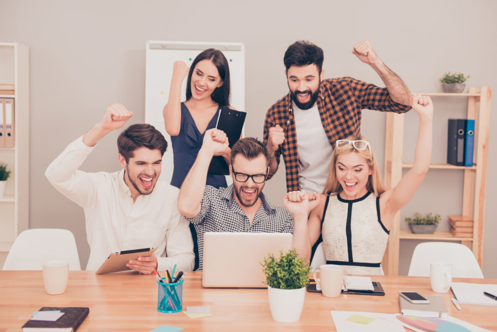 Amaze News! Photo Of  Happy Young Workers Sitting And Looking At