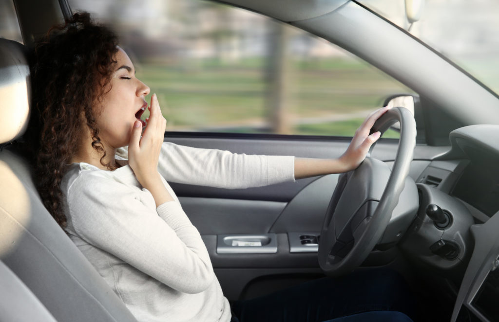 Woman sleeping in car